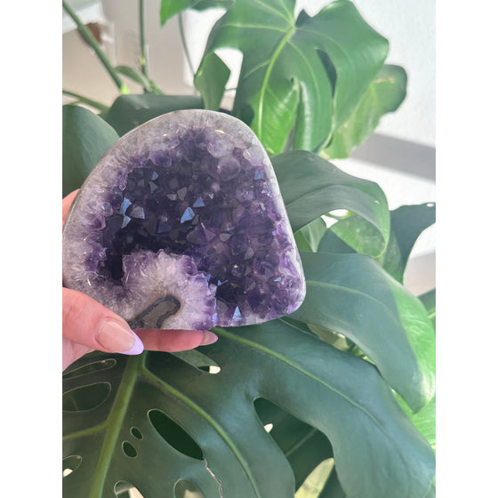 Polished amethyst base weighing 2 lbs, showcasing a deep purple hue and smooth finish, perfect for healing, meditation, and home decor.