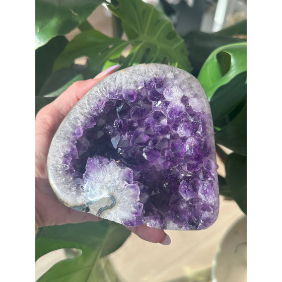 Polished amethyst base weighing 2 lbs, showcasing a deep purple hue and smooth finish, perfect for healing, meditation, and home decor.