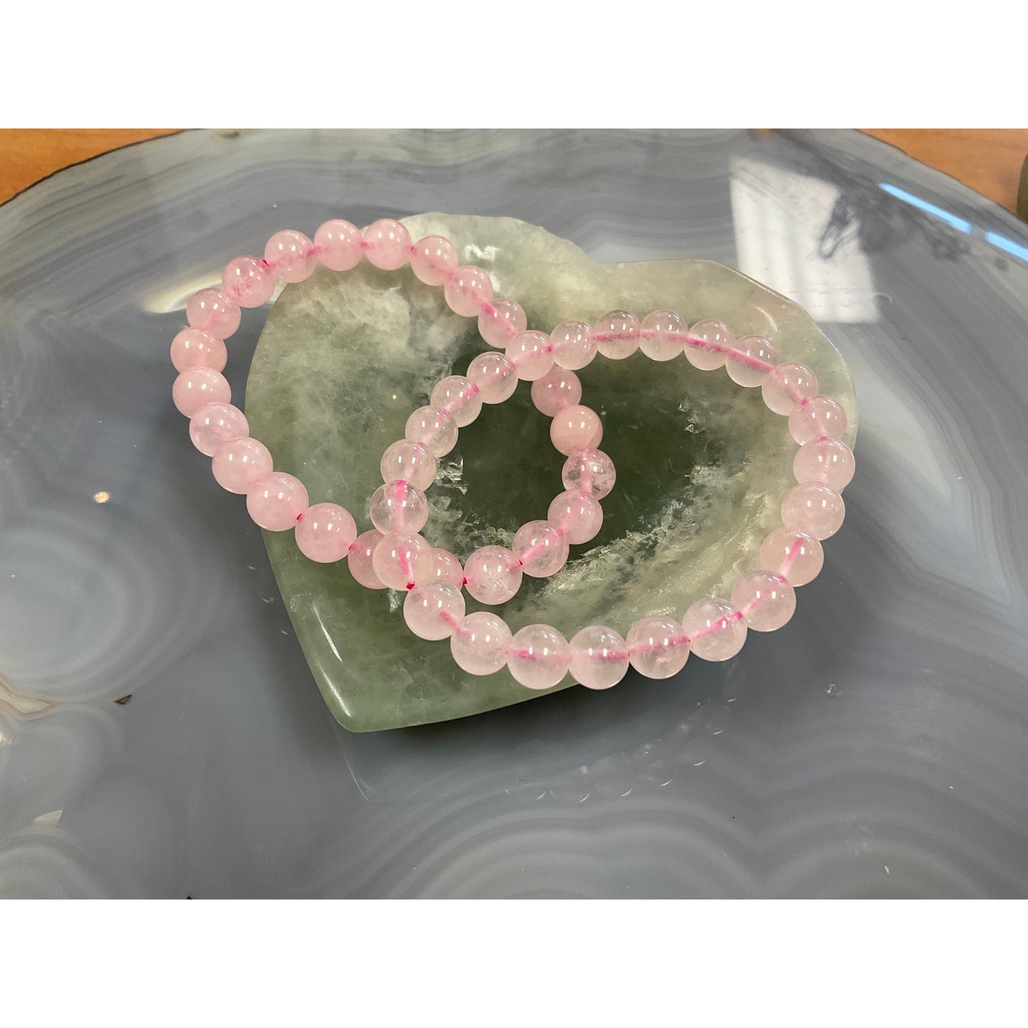 Rose quartz stretch bracelet side view, soft pink 8mm natural crystal beads for emotional healing