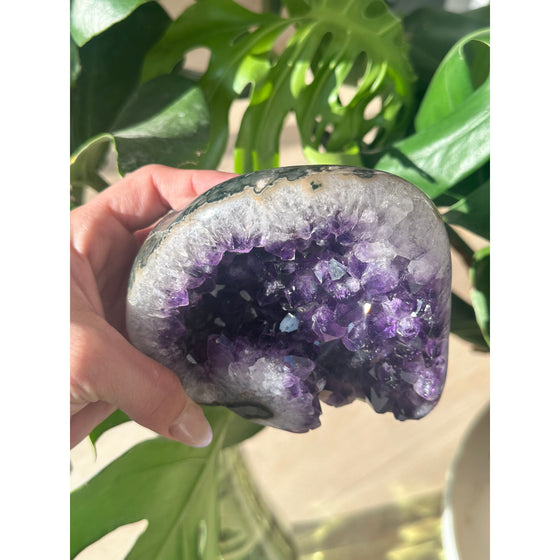 Polished amethyst base weighing 2 lbs, showcasing a deep purple hue and smooth finish, perfect for healing, meditation, and home decor.